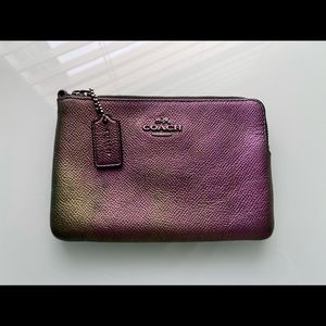 Coach leather wristlet pouch in iridescent finish.